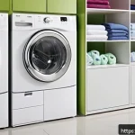 Home 20 기계식 건조기 사용법과 관리 팁 - A modern laundry room scene showing a front-loading dryer with a clear digital control panel display...